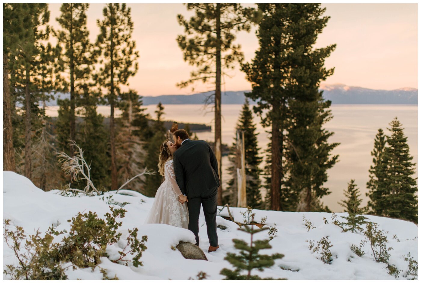bride and groom kissing in the snow on their elopement day in lake tahoe