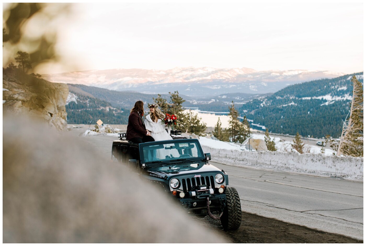 bride and groom driving a jeep along snowy roads during their winter elopement in lake tahoe