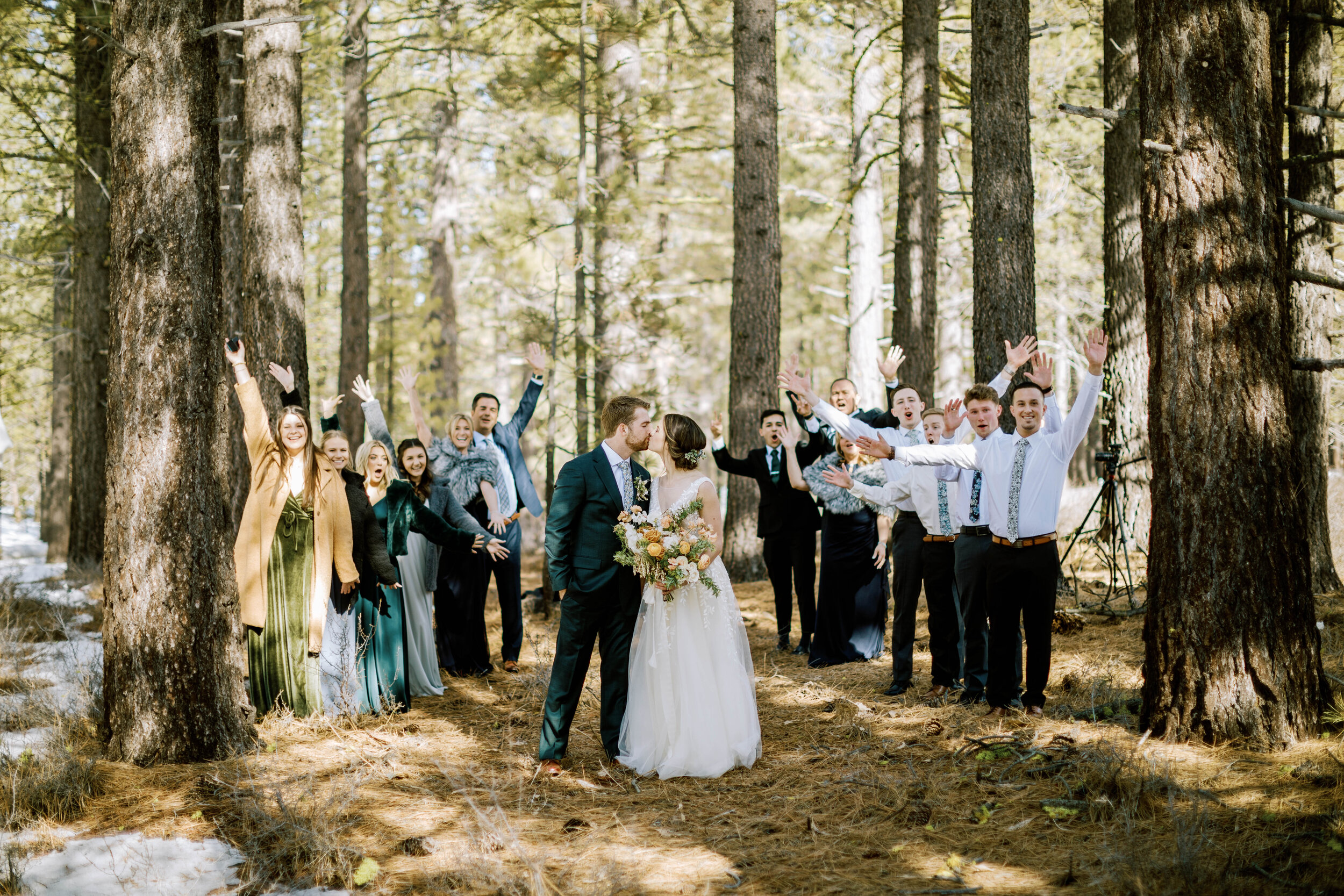 bride and groom cheers with their wedding guests